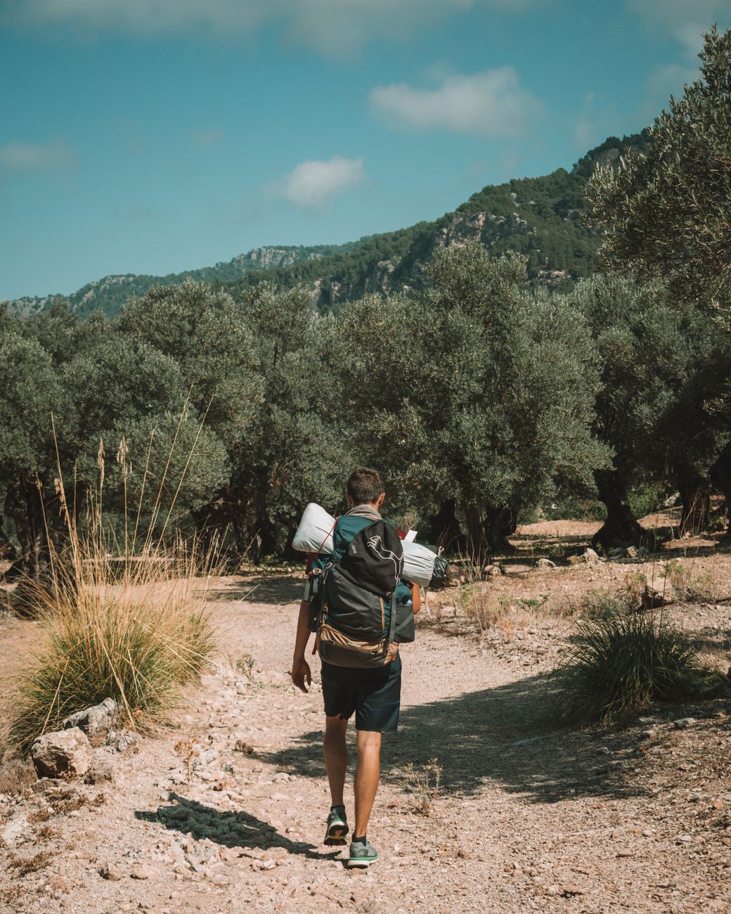 Kayaking near sea caves along Mallorca's rugged coastline